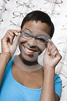 An African American Woman Trying On Glasses