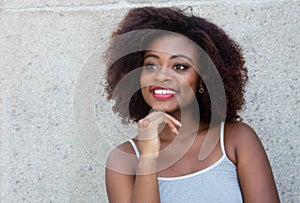 African american woman with typical afro hair looking sideways