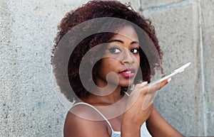 African american woman with typical afro hair speaking voice mes