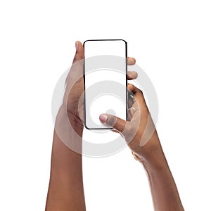 African American Woman Using Cellphone With Empty Screen, Closeup