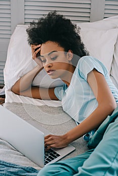 African american woman using laptop