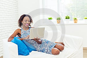African american woman using laptop