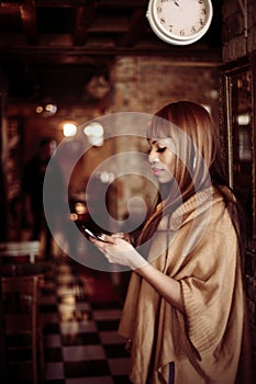 African American woman using smart phone.