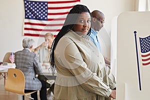African-American Woman in Voting Booth