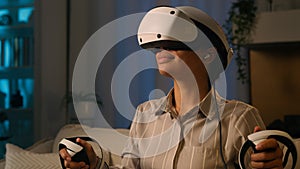 African American woman in VR helmet virtual reality glasses play modern metaverse video game simulation female gamer