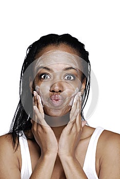 African American woman washing her face