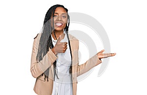 African american woman wearing business jacket showing palm hand and doing ok gesture with thumbs up, smiling happy and cheerful