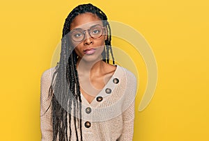 African american woman wearing casual clothes relaxed with serious expression on face