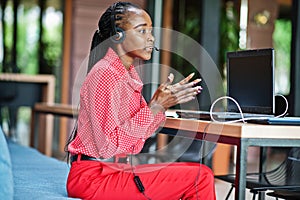 African american woman works in a call center.