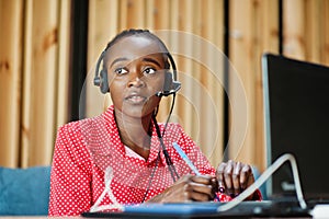 African american woman works in a call center.