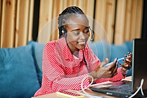 African american woman works in a call center.