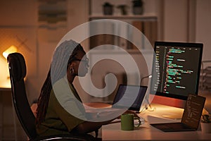 African-American Woman Writing Computer Code