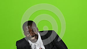 African american wonderful guy, his smile conquers all, and laughter is contagious. Green screen. Slow motion