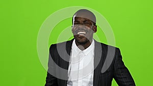 African american wonderful guy, his smile conquers all, and laughter is contagious. Green screen. Slow motion