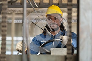 African american worker man wear safety helmet driver forklift warehouse in factory. Male worker industrial operate. control