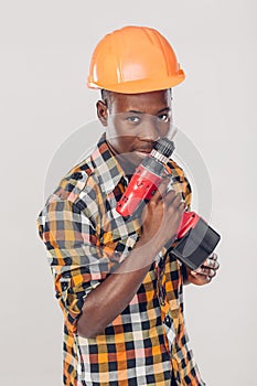 African American worker uses electric screwdriver