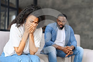 African-American couple arguing at home