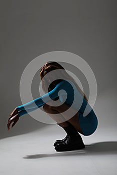 African American young woman posing and showing perfect body. Vertical mock-up.