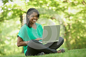 African American young woman using laptop computer