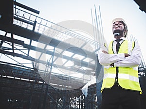 African architects engineer man with hardhat work together in the inside the construction building site.Engineering concepts