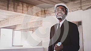 African architects engineer manager with tablet work together in the inside the construction building site