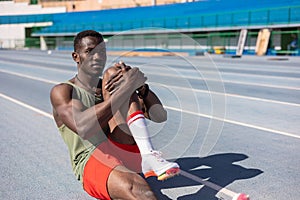 african athlete warming up on the athletics track