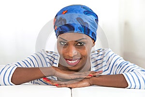 African beauty. Beautiful woman wearing a headscarf and looking at camera