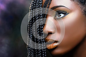 African beauty female face with braids . photo