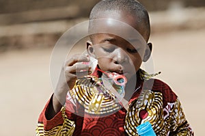 African black boy Blowing Bubbles Outdoors