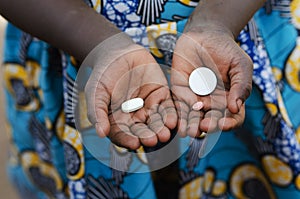 African Black Child Showing Pills as Medicine in Mali