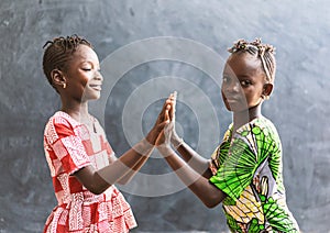 African Black Children Playing with Hands Smiling