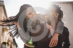African black couple having fun outdoor in city tour - Young people lovers enjoying time together during vacation journey - Love,