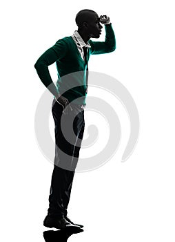 African black man standing tiptoe looking away silhouette