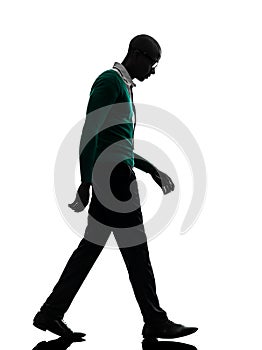 African black man walking looking down sad silhouette