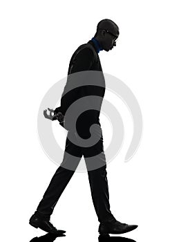 African black man walking looking down silhouette