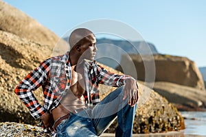 African black model with six pack in unbuttoned checkered shirt photo