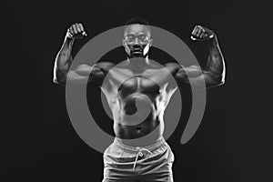 African bodybuilder demonstrating his strong muscular body