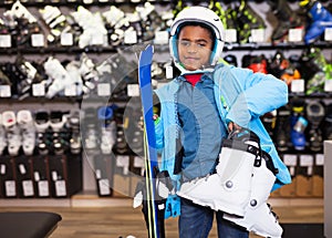 African boy with ski equipment