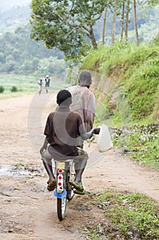 African boys carring water