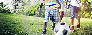 African Brother Playing Football Outdoors Concept