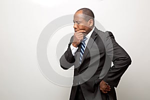 African Business Man Dressed in Suit Thinking