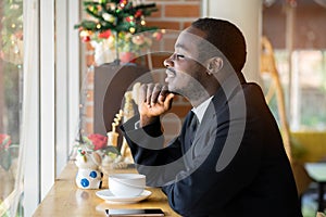 African business man thinking in the cafe or coffee shop