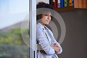 African, business and woman thinking and standing in doorway, outside and working from home break. Black female person