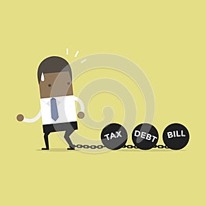 African businessman dragging chains and big ball, Debt Tax and Bill burden concept.