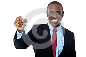 African businessman holding a key