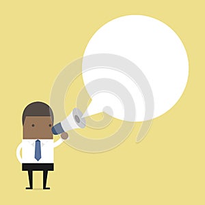 African businessman holding megaphone with speech bubble for text.