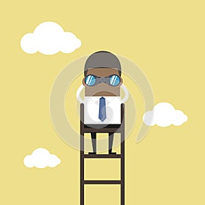 African businessman on a ladder using binoculars above cloud.