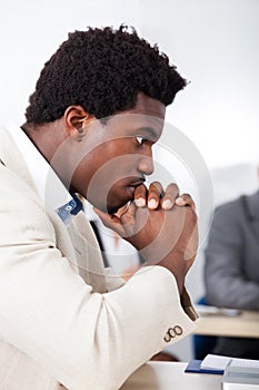 African businessman looking at laptop