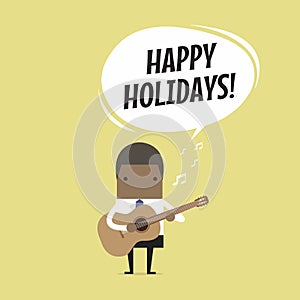 African businessman is playing a guitar and sing Happy Holidays.