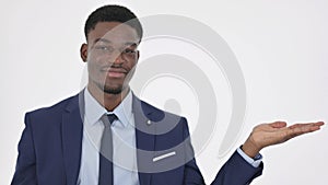 African Businessman Showing Product on Side, White Background